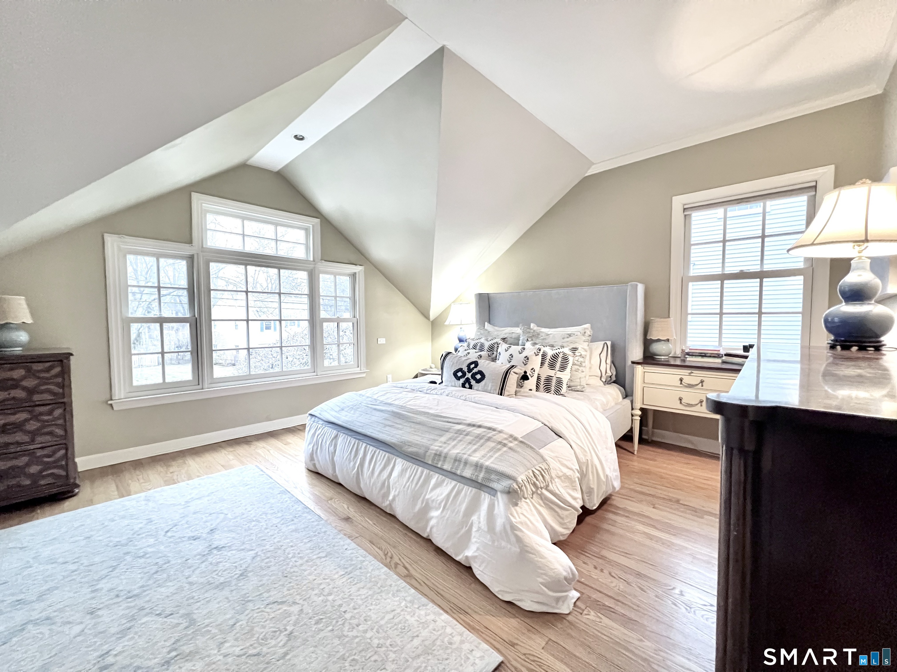 14 Laforge Road Darien, CT 06820 - Photo 24 of 35 a spacious bedroom with a large bed and a window