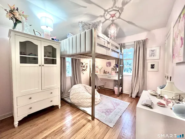 a bedroom with furniture and a window
