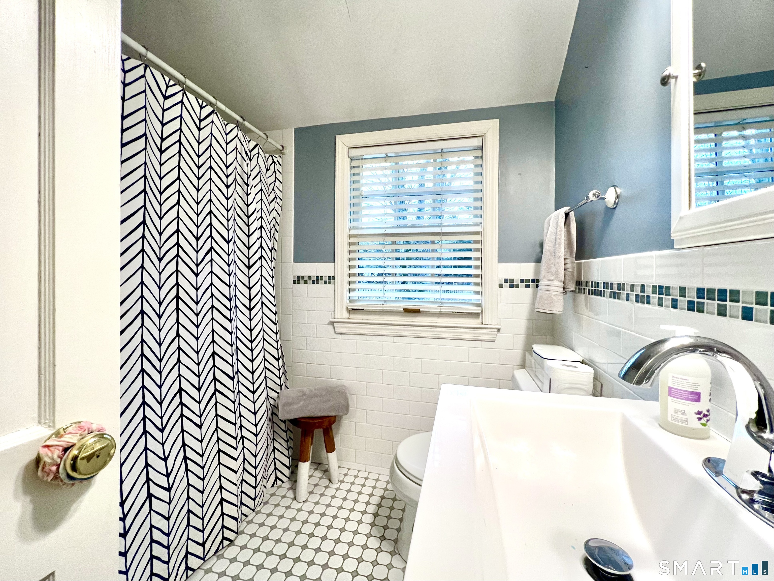 14 Laforge Road Darien, CT 06820 - Photo 29 of 35 a bathroom with a sink a bathtub and next to a window