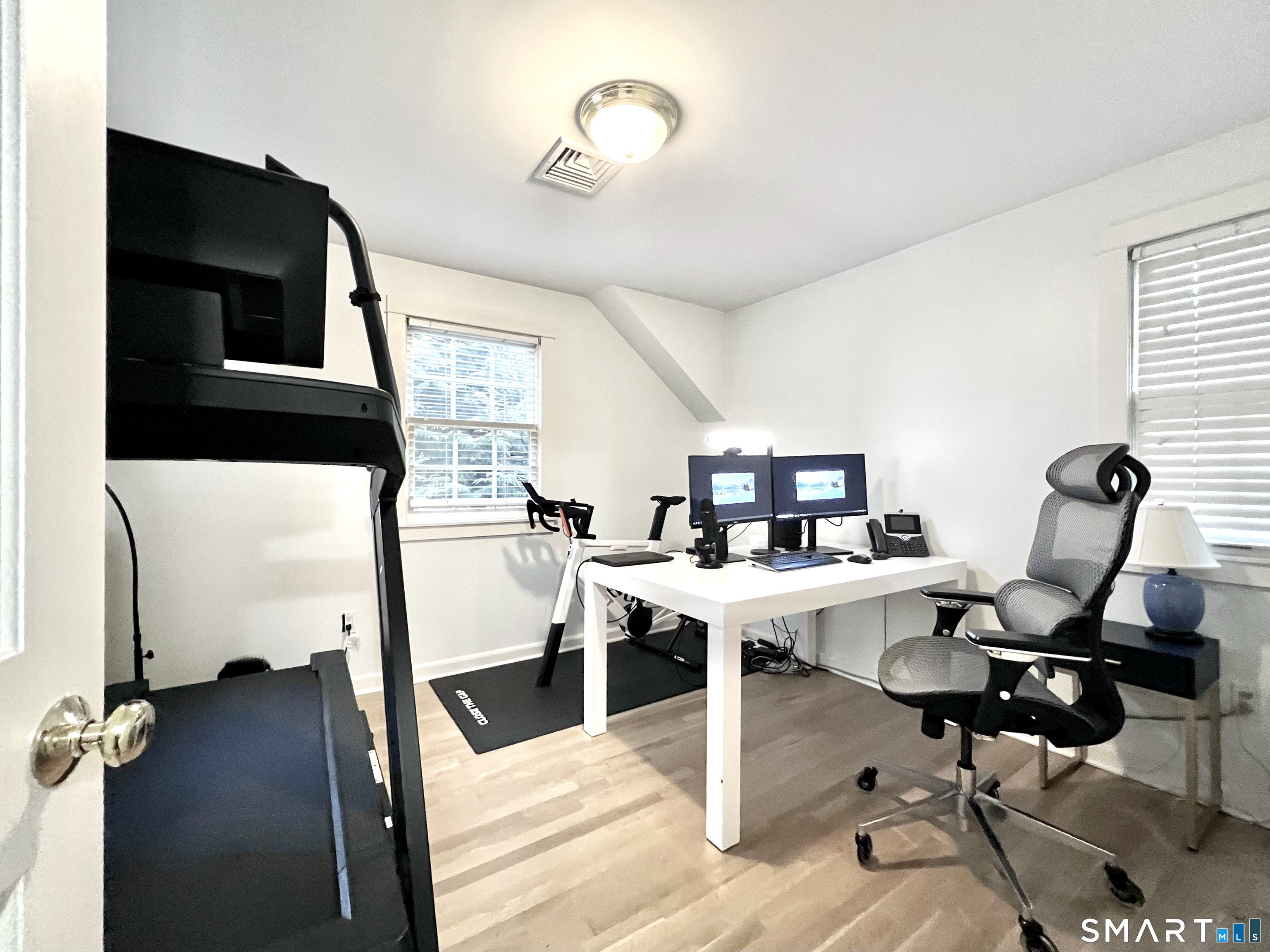 14 Laforge Road Darien, CT 06820 - Photo 31 of 35 a view of a workspace with furniture and a flat screen tv