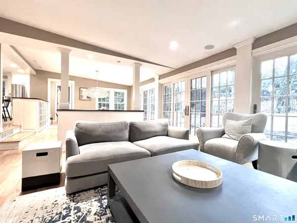 a living room with furniture and a large window