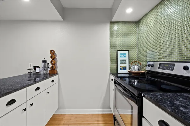 a kitchen that has a sink and a stove
