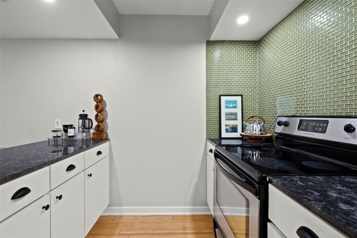2200 Dickson Drive, Unit 108 Austin, TX 78704 - Photo 10 of 34 a kitchen that has a sink and a stove