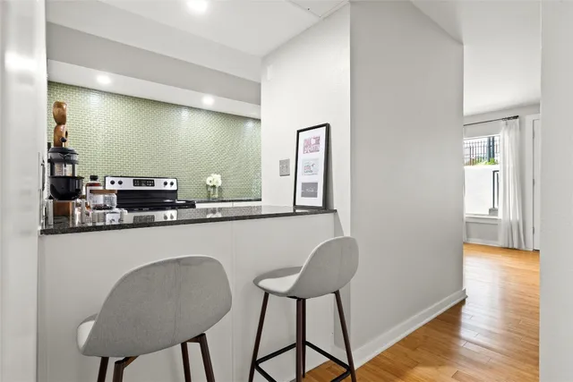a kitchen with a table and chairs in it
