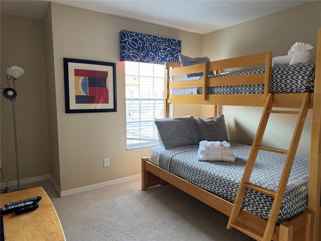 8975 Candy Palm Road Kissimmee, FL 34747 - Photo 17 of 27 a living room with furniture and a window