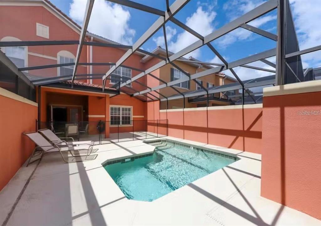 8975 Candy Palm Road Kissimmee, FL 34747 - Photo 21 of 27 a view of a backyard with sitting area