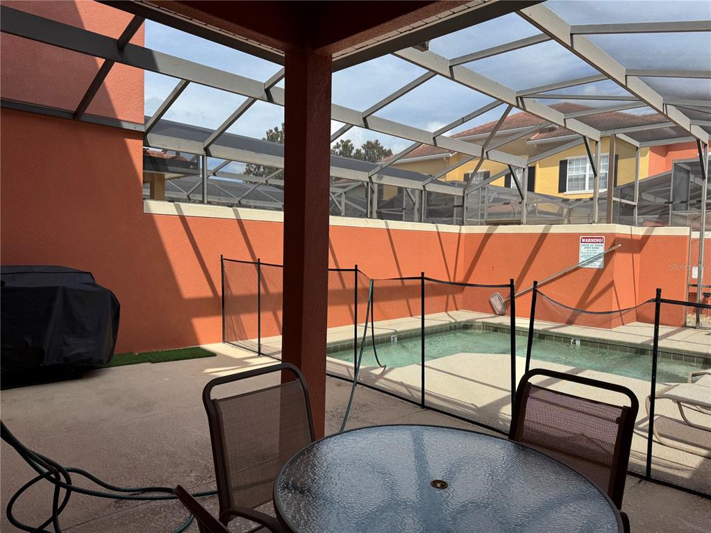 8975 Candy Palm Road Kissimmee, FL 34747 - Photo 23 of 27 a view of a room with furniture and a window