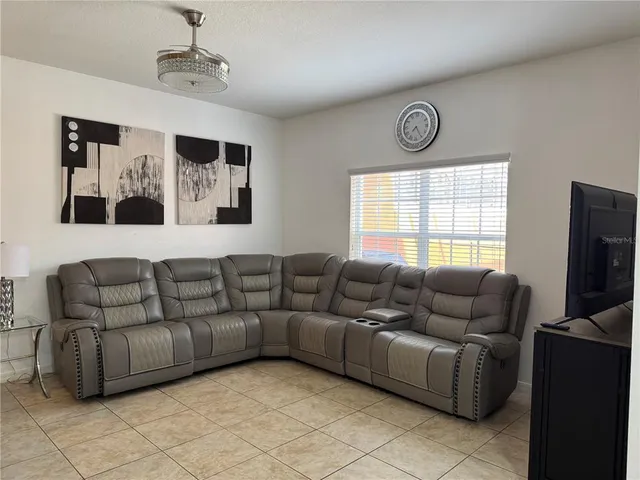a living room with furniture and a window