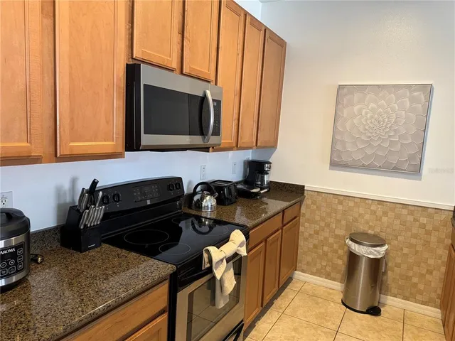 a kitchen with a stove and a microwave