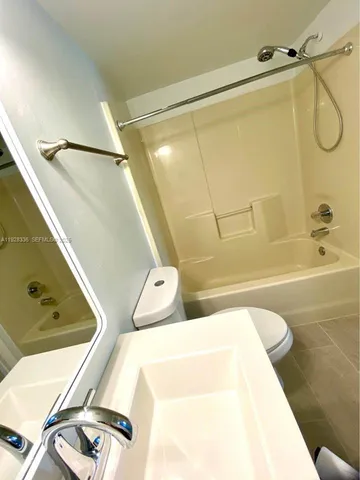 a view of a lake with houses in the back