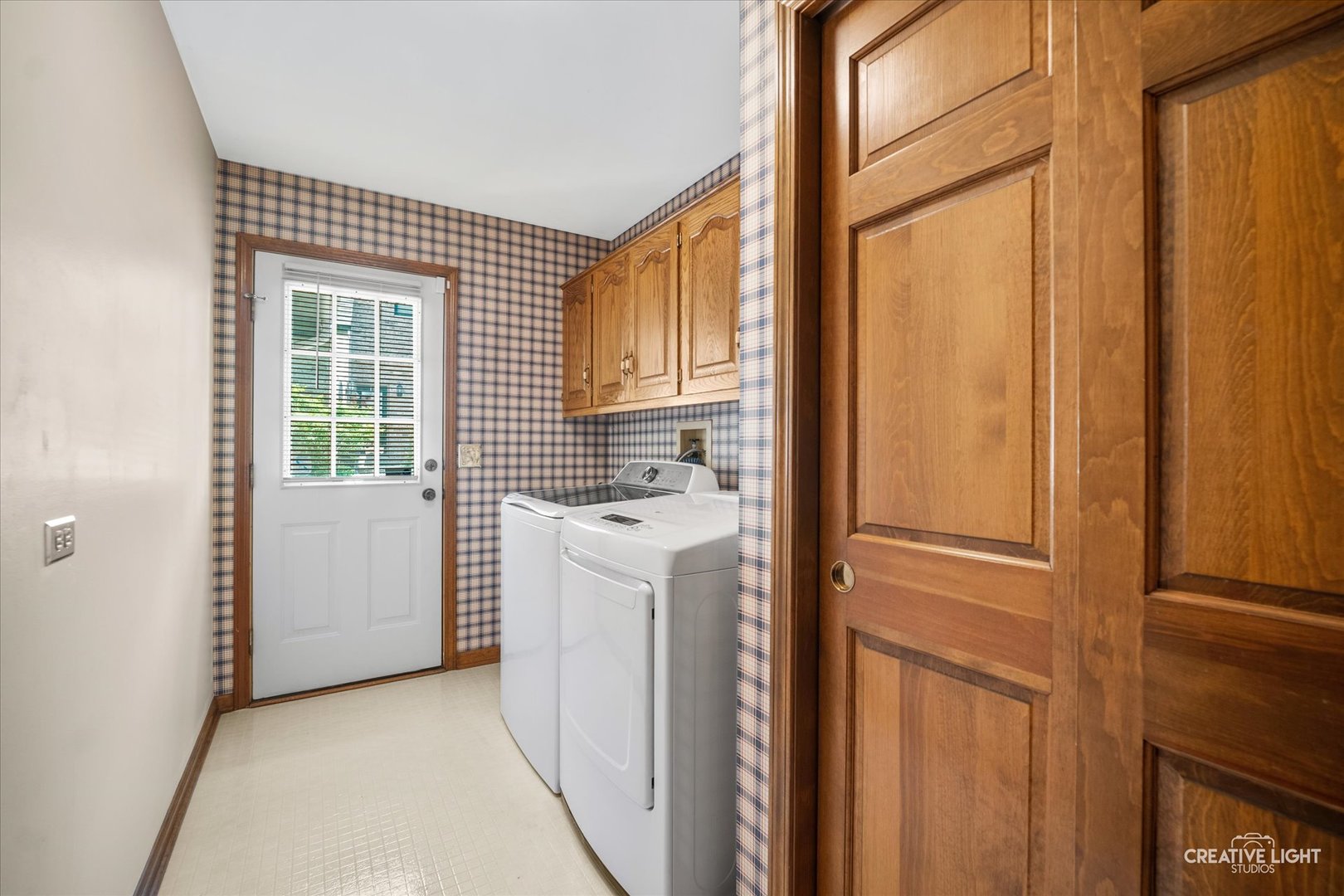 3112 Turnberry Road St. Charles, IL 60174 - Photo 15 of 43 a view of a kitchen with white cabinets and white appliances