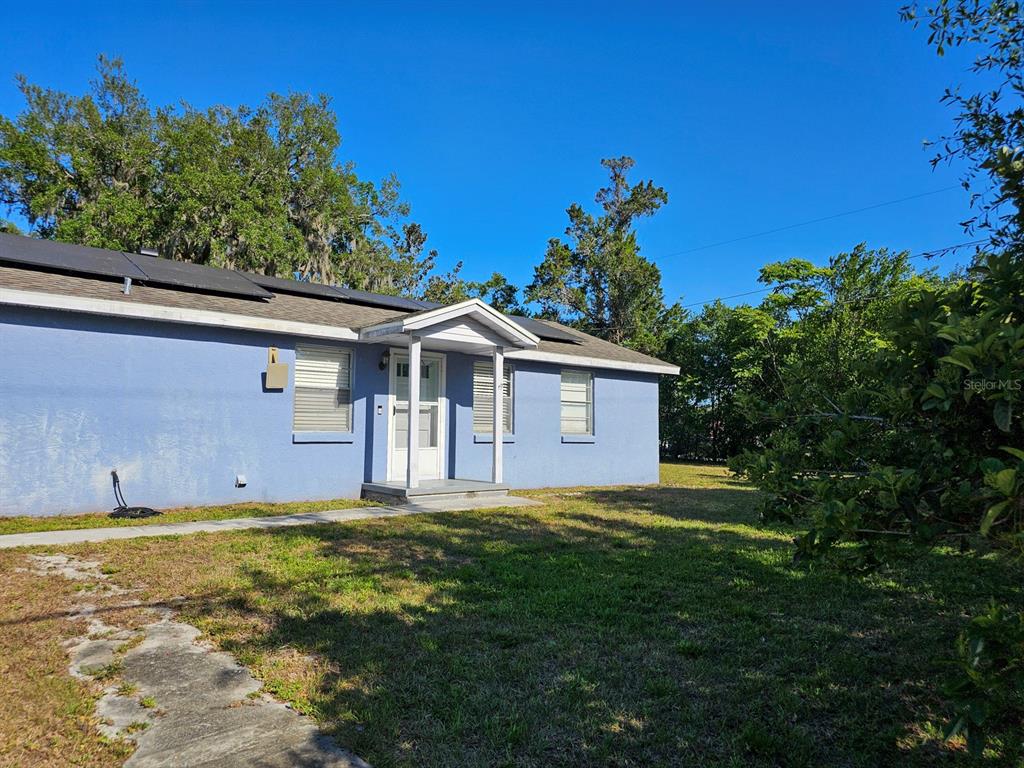 15 Estrella Road DeBary, FL 32713 - Photo 1 of 1 a front view of a house with a yard