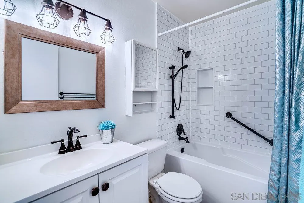 749 Nob Circle Vista, CA 92084 - Photo 16 of 23 a bathroom with a sink a toilet and a bathtub
