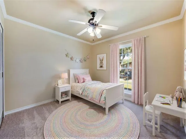 a room with a bed and a chandelier