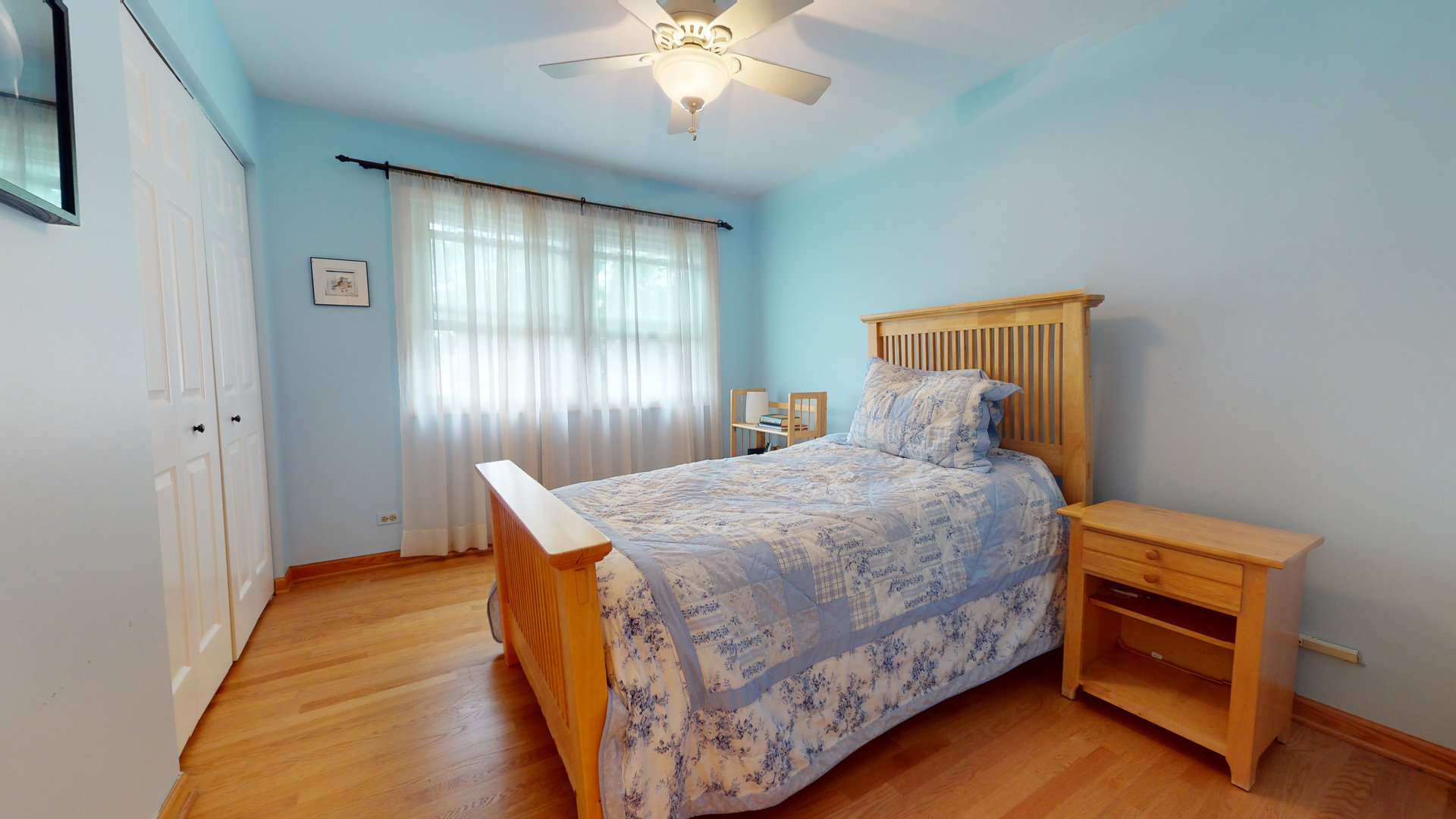 1245 Dayton Road Buffalo Grove, IL 60089 - Photo 11 of 16 a bedroom with a bed and a chandelier