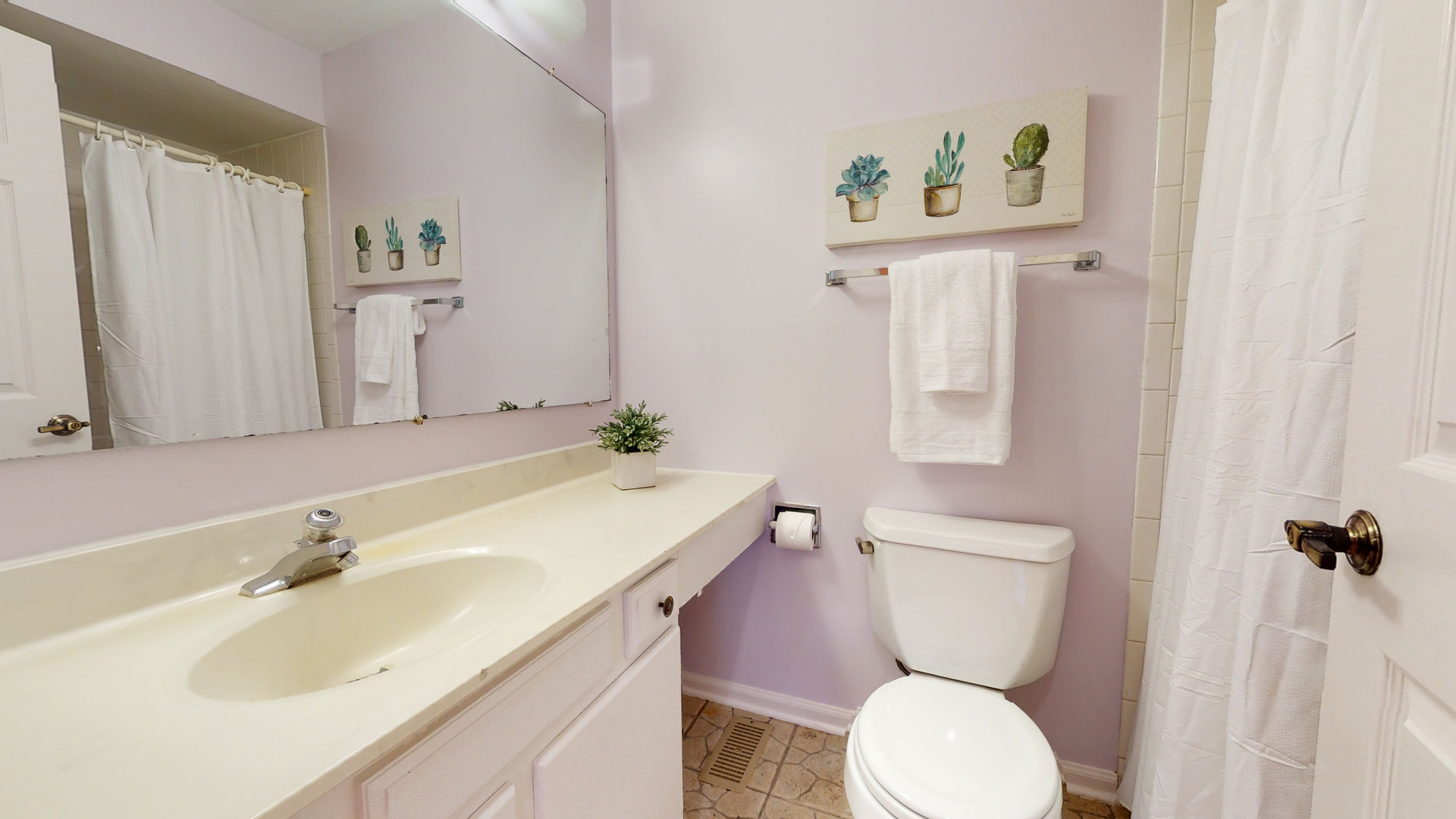 1245 Dayton Road Buffalo Grove, IL 60089 - Photo 12 of 16 a bathroom with a toilet sink and mirror