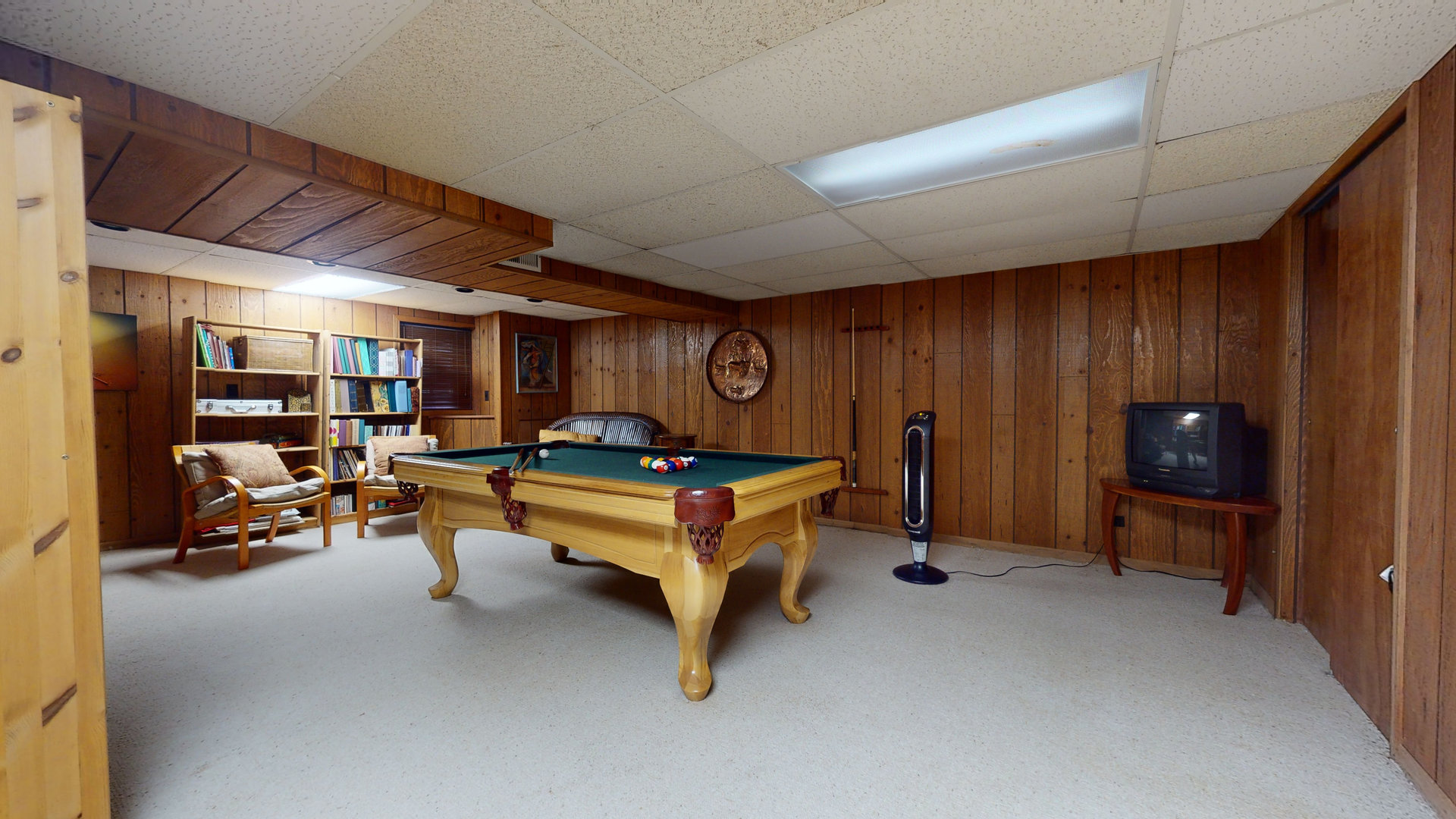 1245 Dayton Road Buffalo Grove, IL 60089 - Photo 13 of 16 a living room with furniture gym equipment and a flat screen tv