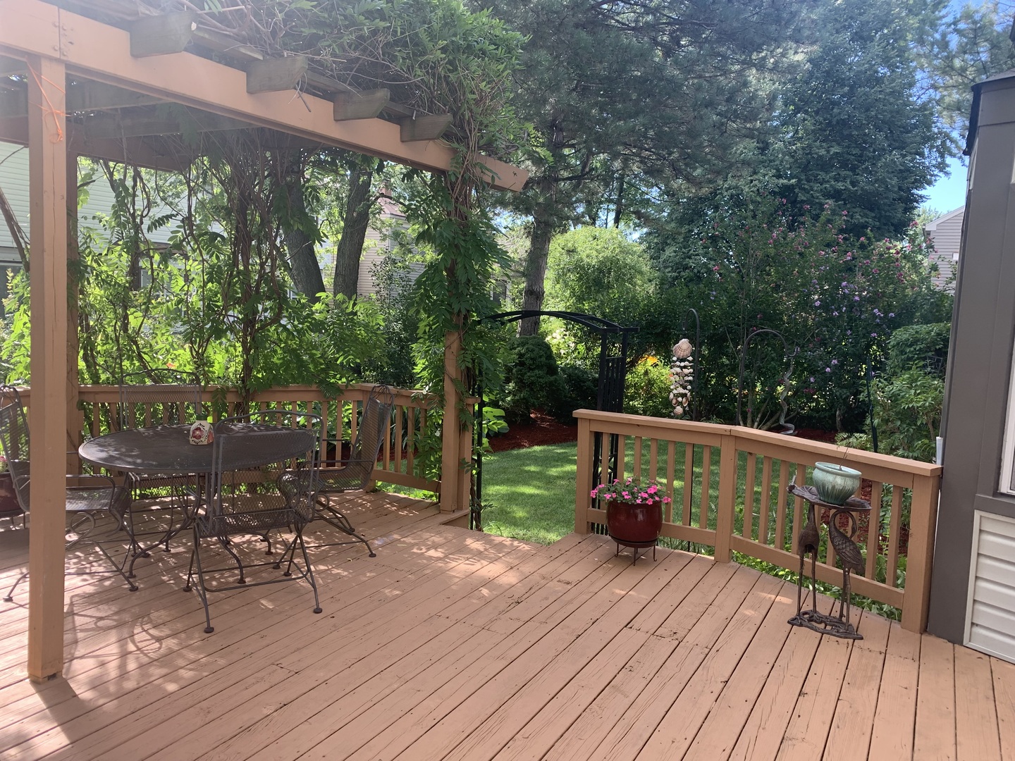 1245 Dayton Road Buffalo Grove, IL 60089 - Photo 16 of 16 a view of a deck with wooden floor and bench