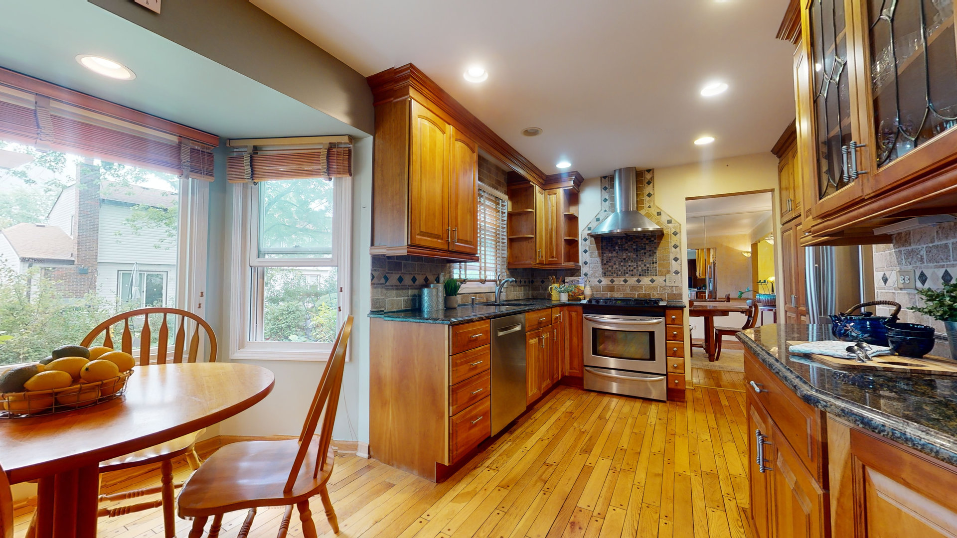 1245 Dayton Road Buffalo Grove, IL 60089 - Photo 4 of 16 a kitchen with a sink and wooden cabinets