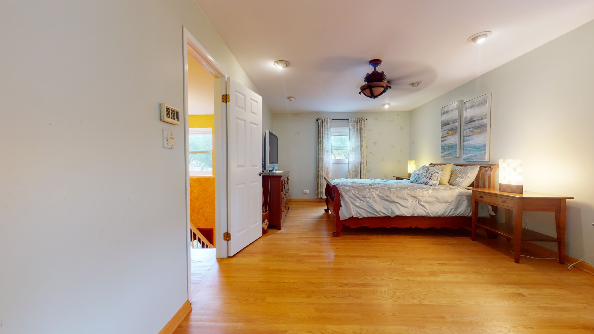 1245 Dayton Road Buffalo Grove, IL 60089 - Photo 7 of 16 a bedroom with a bed dresser and a window