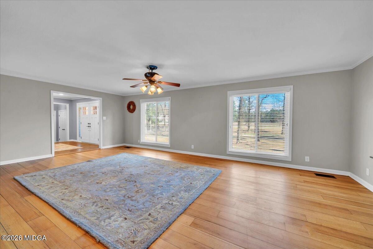 5256 Rivoli Drive Macon, GA 31210 - Photo 12 of 91 wooden floor in an empty room with a window