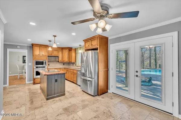 a view of livingroom with hardwood floor and a ceiling fan