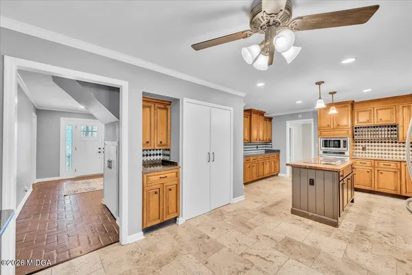 a view of a kitchen with a sink and a window