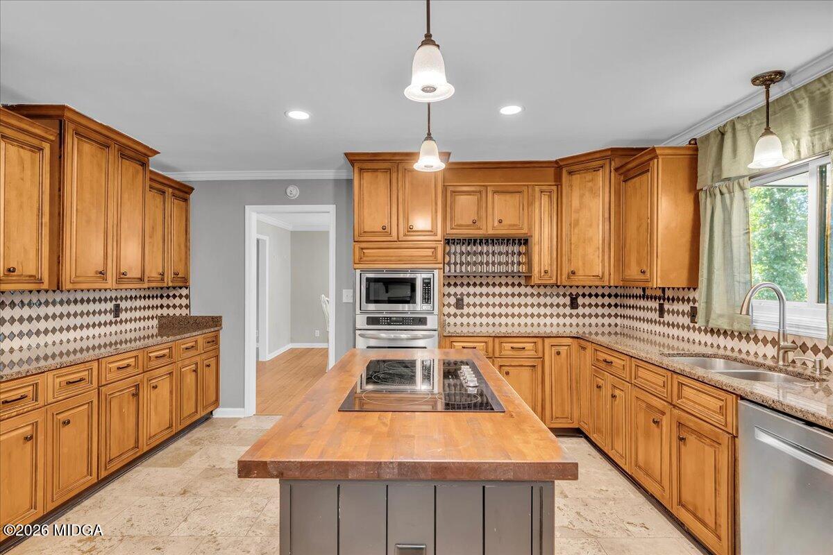5256 Rivoli Drive Macon, GA 31210 - Photo 20 of 91 a kitchen with stainless steel appliances a sink stove and cabinets