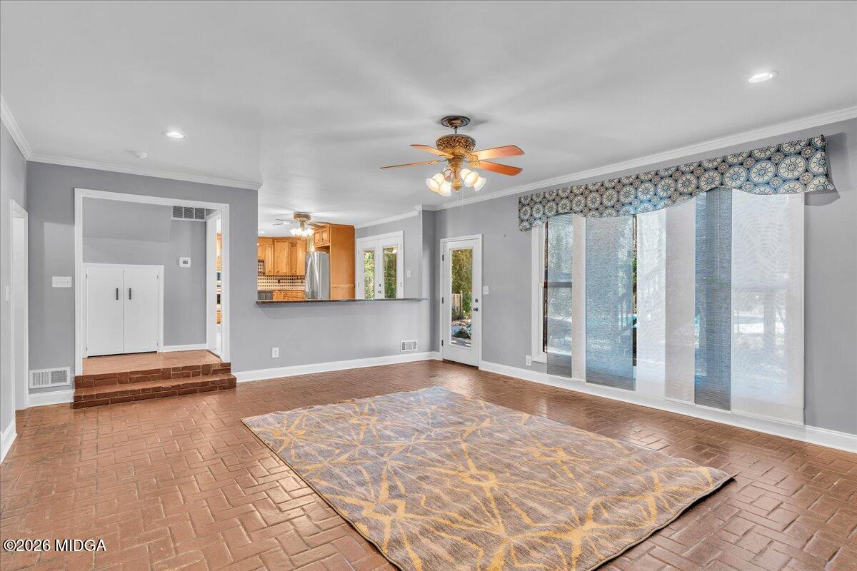 5256 Rivoli Drive Macon, GA 31210 - Photo 27 of 91 a view of livingroom with hardwood floor and a ceiling fan
