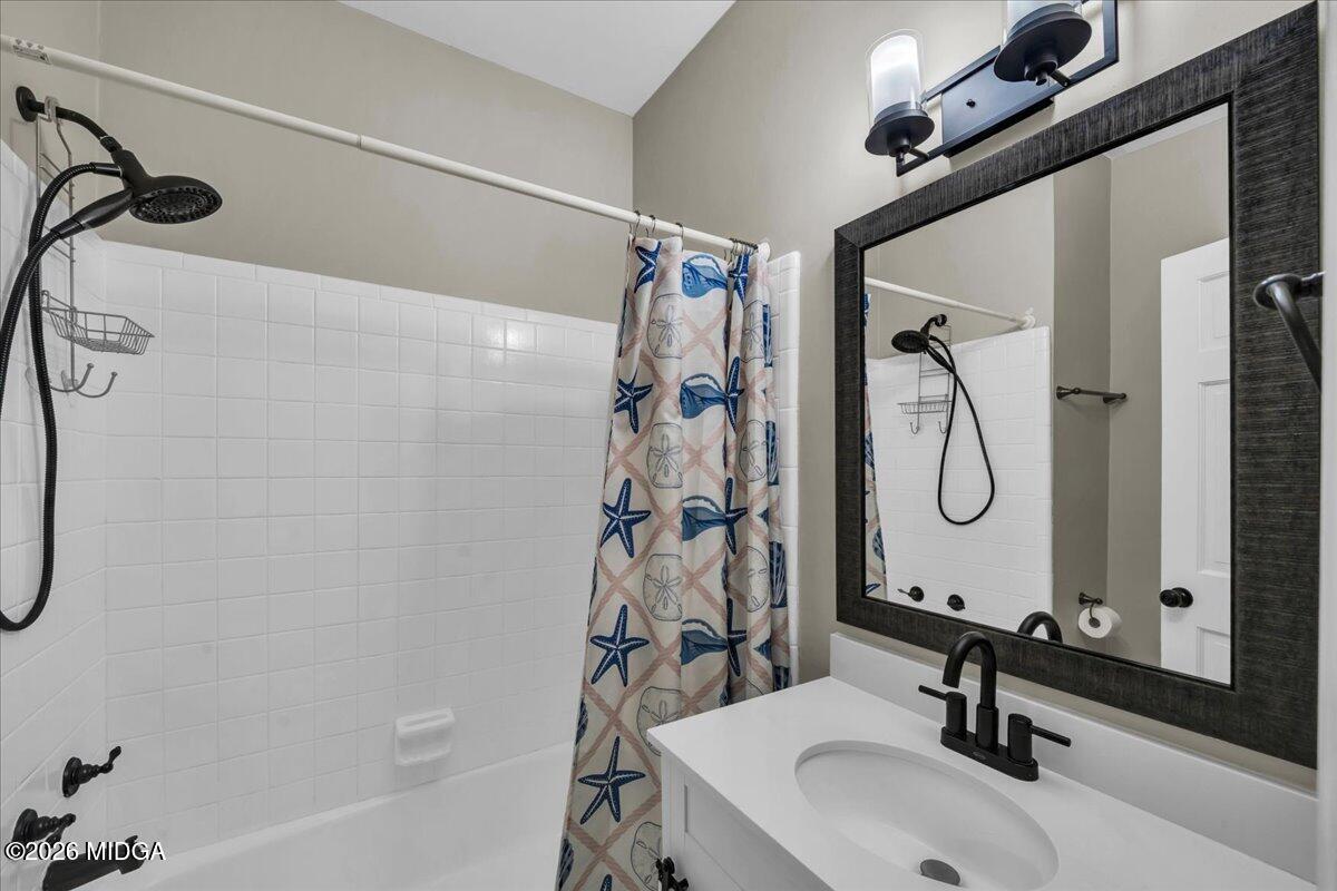 5256 Rivoli Drive Macon, GA 31210 - Photo 35 of 91 a bathroom with a sink and a mirror