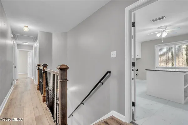 a bathroom with a shower and toilet