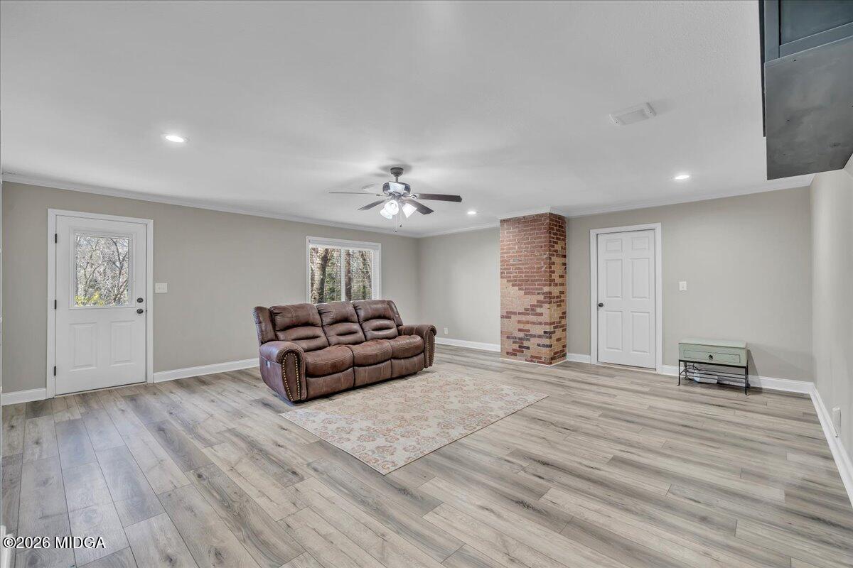 5256 Rivoli Drive Macon, GA 31210 - Photo 37 of 91 a spacious bedroom with a bed and a chandelier
