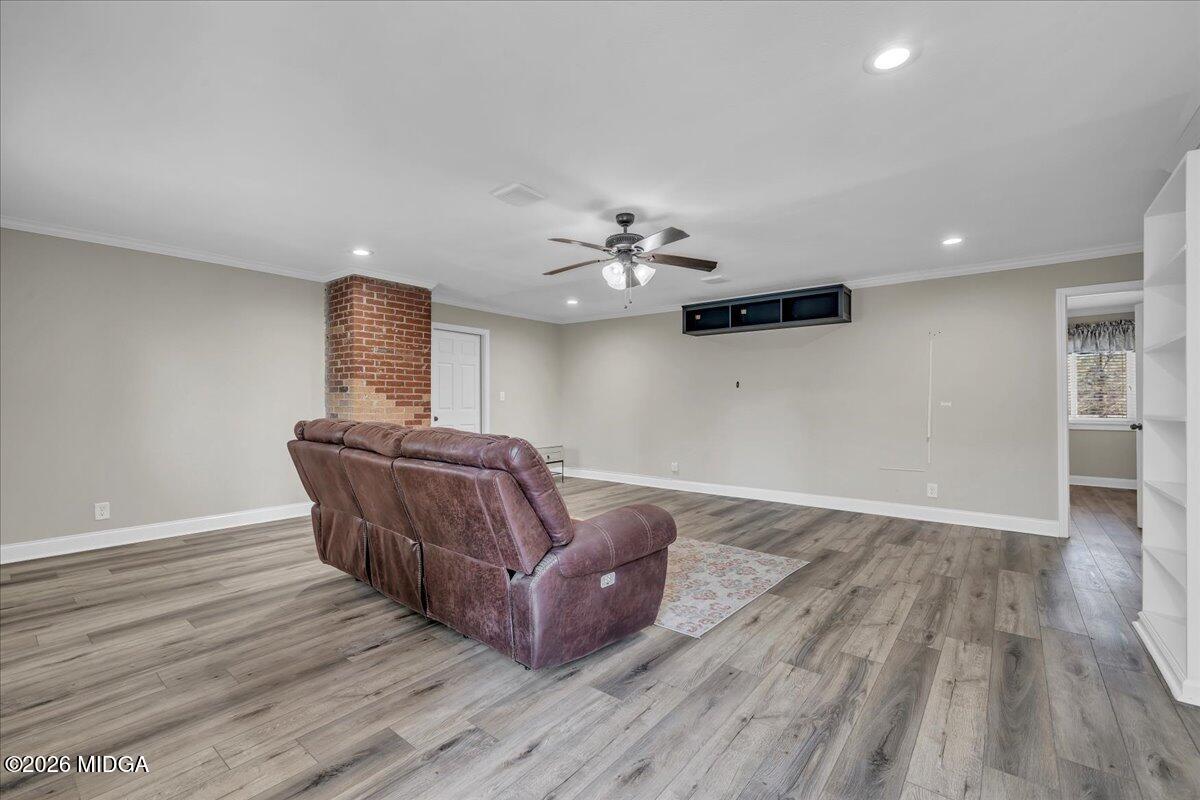 5256 Rivoli Drive Macon, GA 31210 - Photo 40 of 91 a living room with furniture and a wooden floor