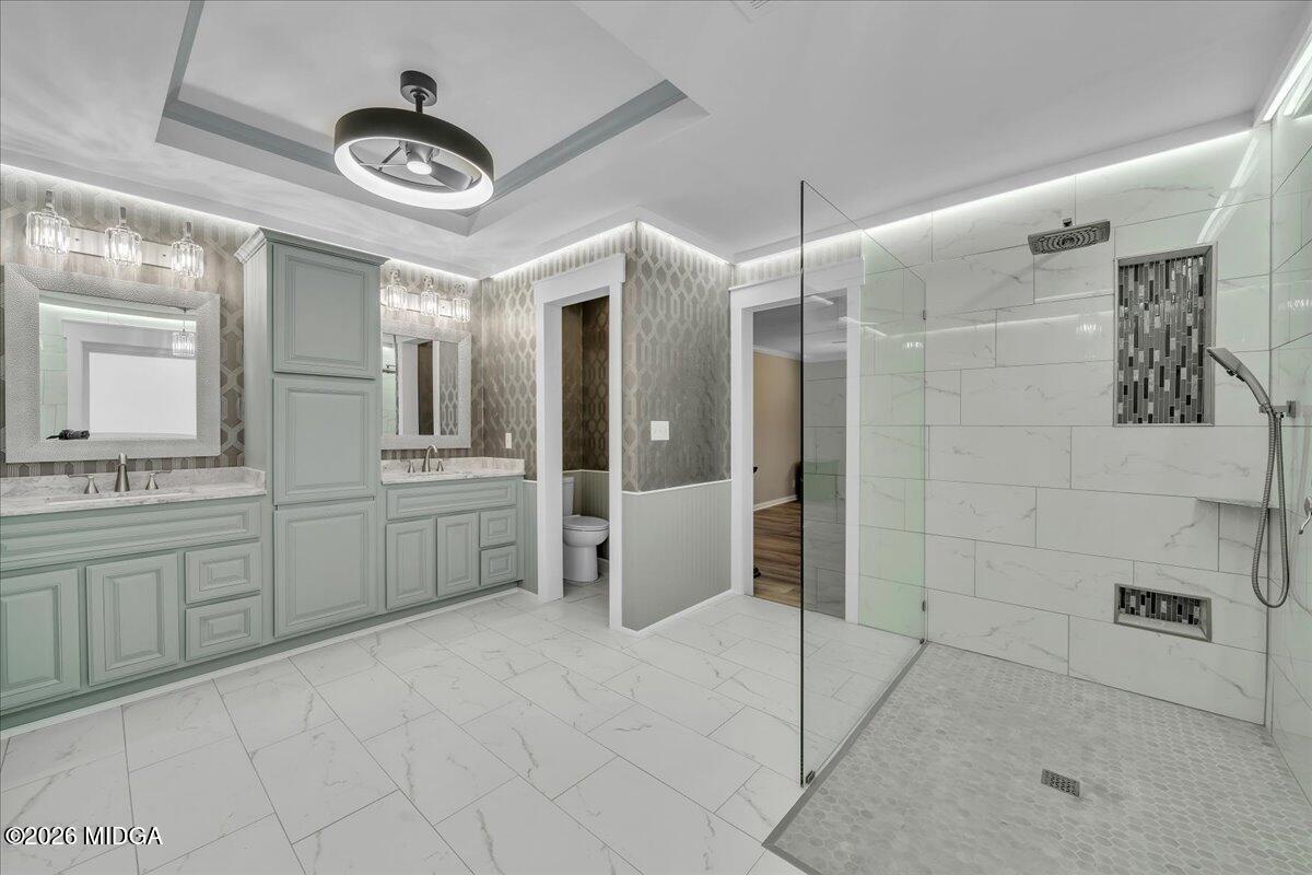 5256 Rivoli Drive Macon, GA 31210 - Photo 4 of 91 a bathroom with a double vanity sink a toilet and shower