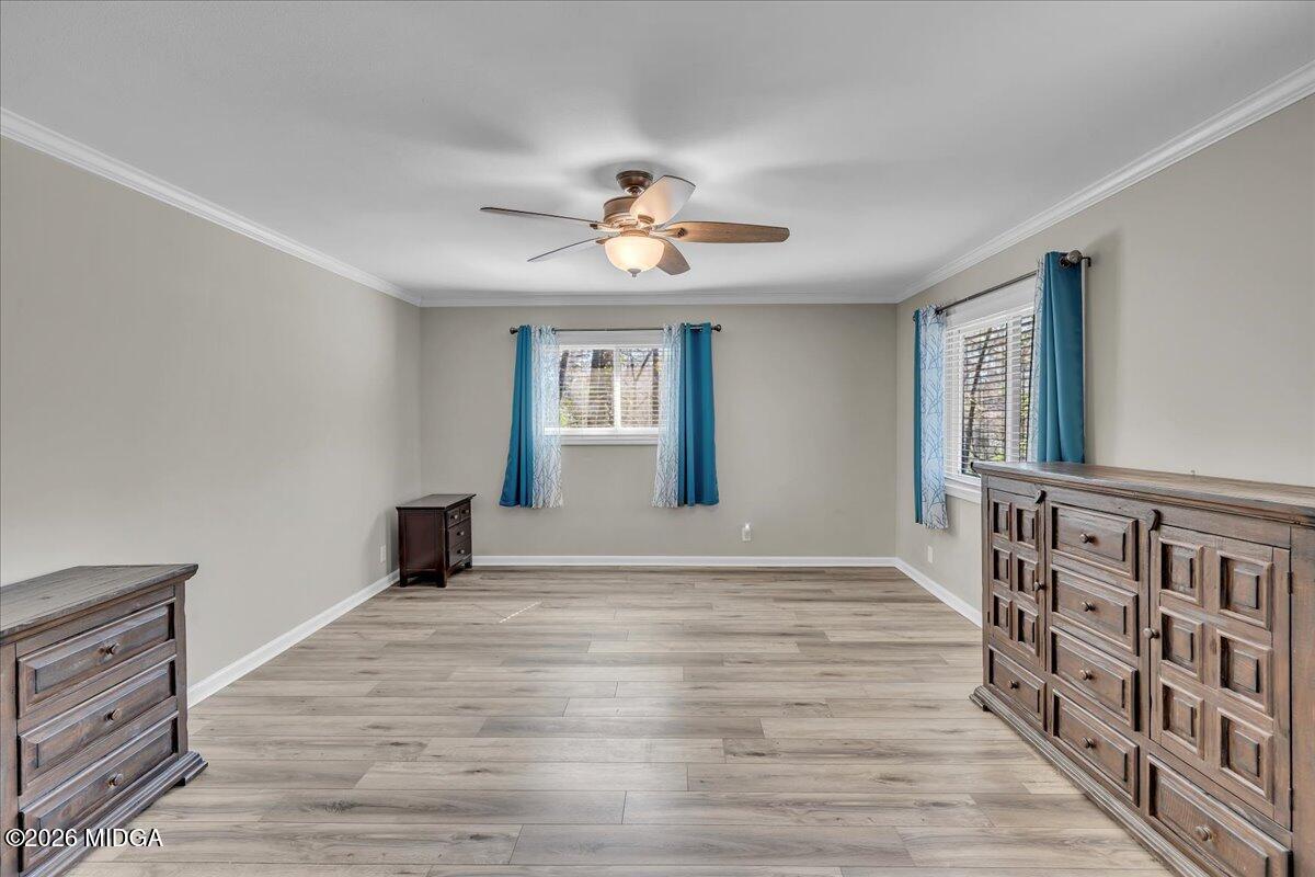 5256 Rivoli Drive Macon, GA 31210 - Photo 48 of 91 a view of an empty room with window and wooden floor