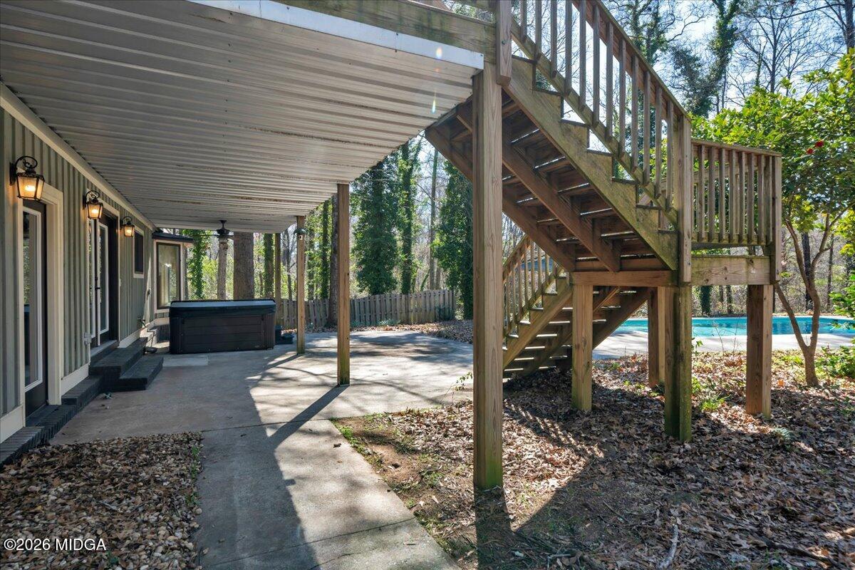 5256 Rivoli Drive Macon, GA 31210 - Photo 69 of 91 a view of a patio with table and chairs with wooden floor and fence