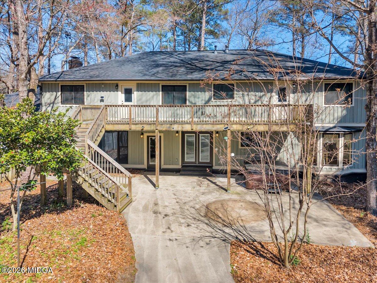 5256 Rivoli Drive Macon, GA 31210 - Photo 80 of 91 a view of a house with a yard covered with snow in the background