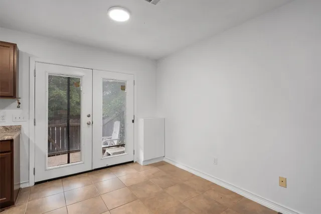 a view of an empty room and window