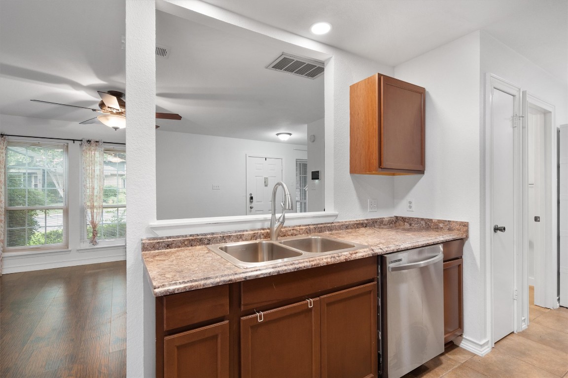 1015 East Yager Lane, Unit 129 Austin, TX 78753 - Photo 16 of 39 a bathroom with a sink and a mirror