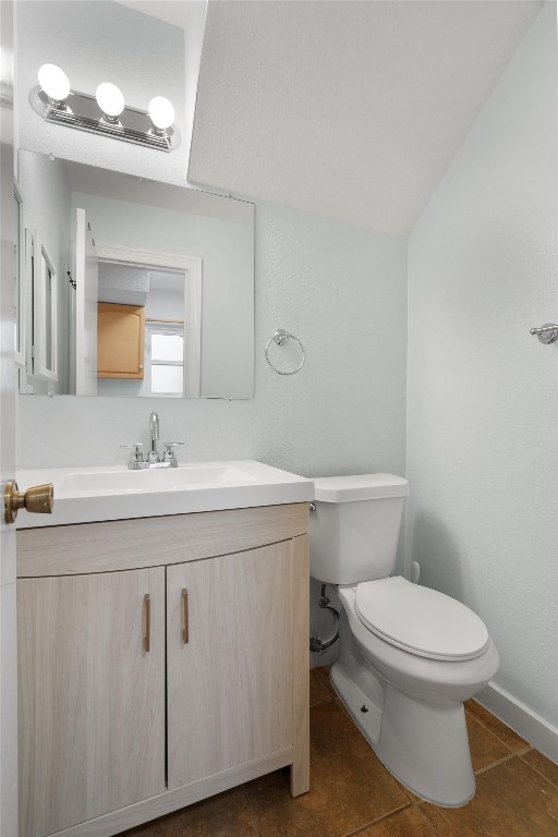 1015 East Yager Lane, Unit 129 Austin, TX 78753 - Photo 18 of 39 a bathroom with a toilet a sink and mirror