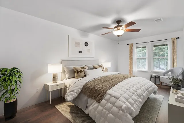 a bedroom with a bed and a window