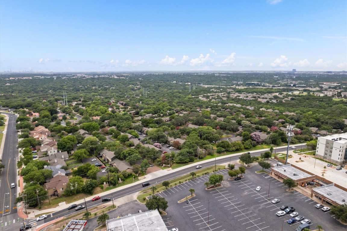 1015 East Yager Lane, Unit 129 Austin, TX 78753 - Photo 2 of 39 a view of a city from a balcony