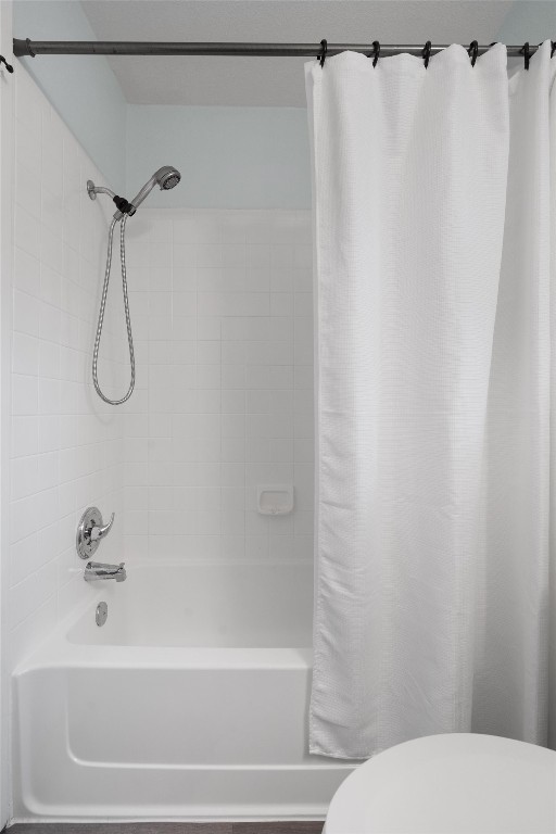 1015 East Yager Lane, Unit 129 Austin, TX 78753 - Photo 25 of 39 a bathroom with a shower and a toilet
