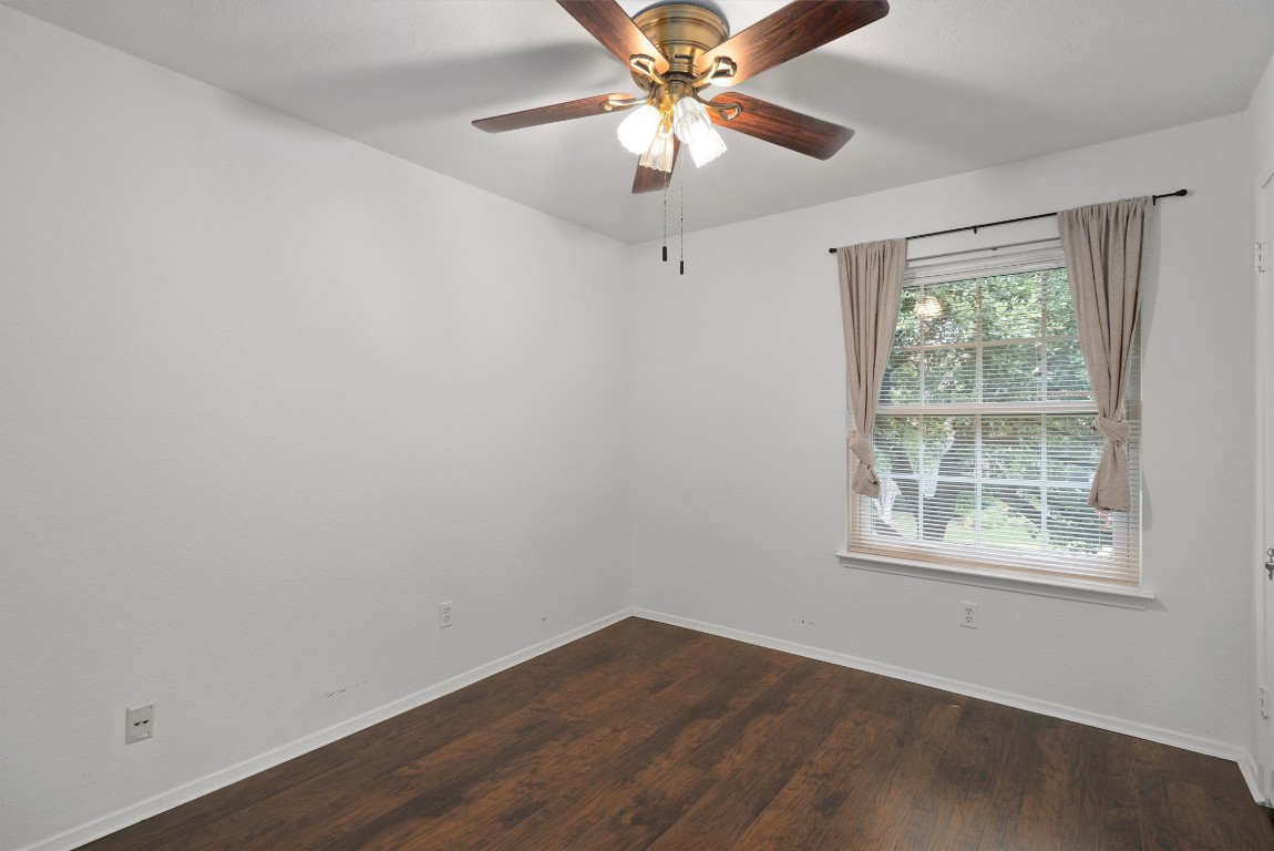 1015 East Yager Lane, Unit 129 Austin, TX 78753 - Photo 27 of 39 an empty room with a window and a fan