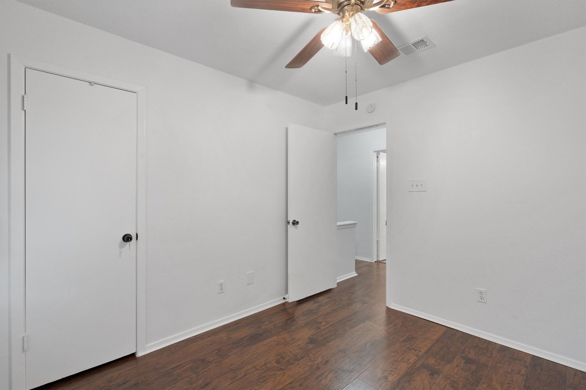 1015 East Yager Lane, Unit 129 Austin, TX 78753 - Photo 28 of 39 a view of an empty room with wooden floor