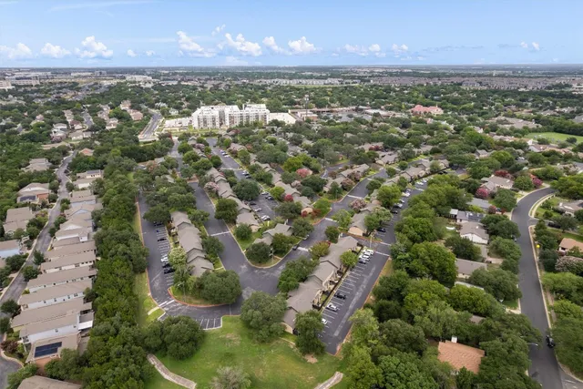 an aerial view of a houses with a lake view