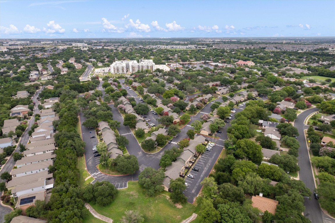 1015 East Yager Lane, Unit 129 Austin, TX 78753 - Photo 3 of 39 an aerial view of a houses with a lake view