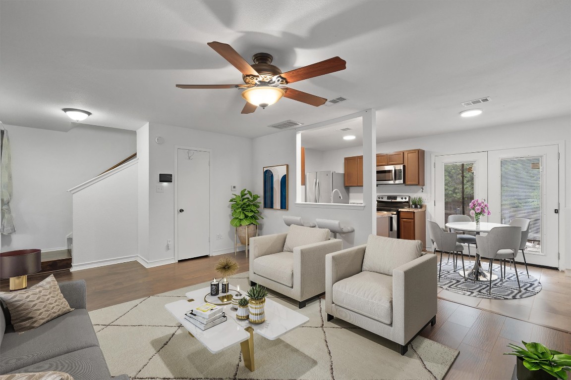 1015 East Yager Lane, Unit 129 Austin, TX 78753 - Photo 10 of 39 a living room with furniture or kitchen view and a chandelier