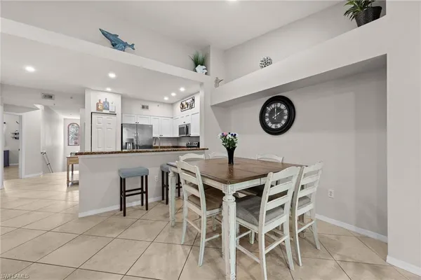 a view of a dining room and kitchen