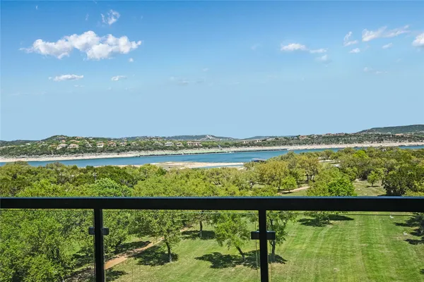 a view of swimming pool from a balcony
